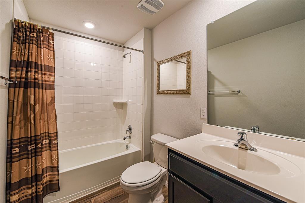 348 Jacquard Court Troy, TX 76579 - Photo 14 of 19 a bathroom with a granite countertop sink toilet and shower