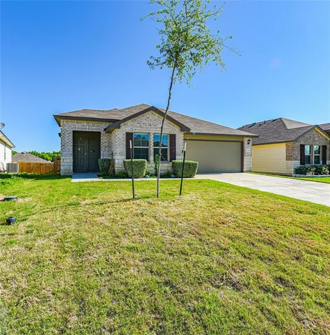a aerial view of a house with a yard