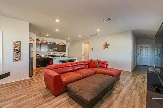 a kitchen with stainless steel appliances granite countertop a stove and a sink