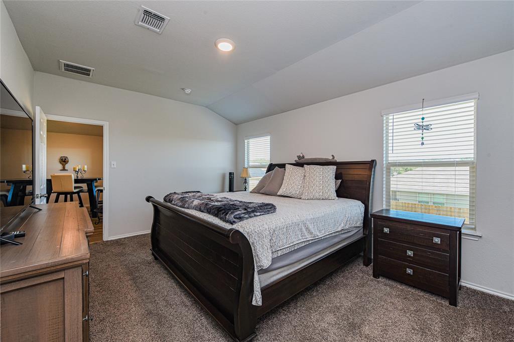 348 Jacquard Court Troy, TX 76579 - Photo 7 of 19 a bedroom with a bed and a dressers