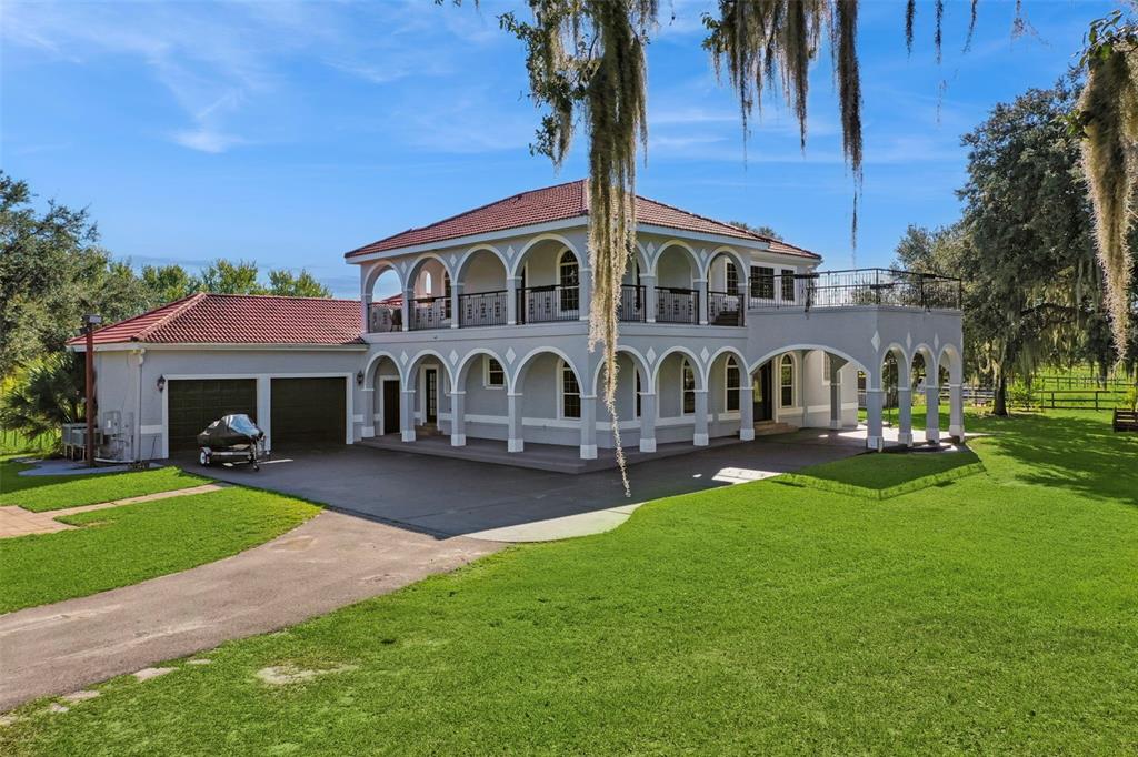 a front view of house with yard barbeque and outdoor seating