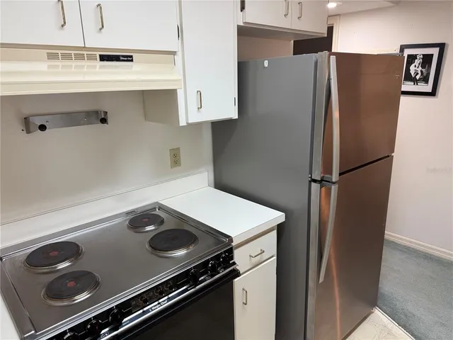 a white toilet sitting next to a bath tub and shower