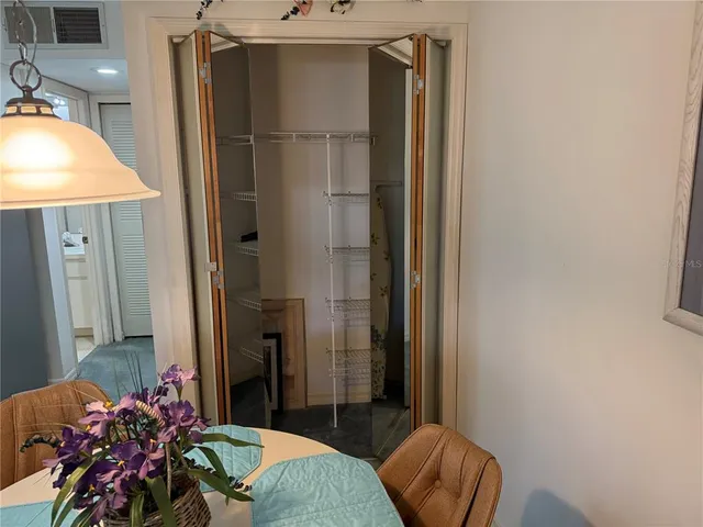 a kitchen with stainless steel appliances a refrigerator and a stove