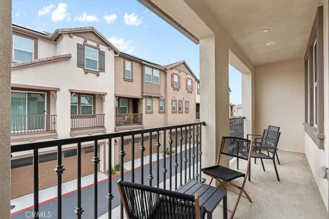a view of a balcony with chairs
