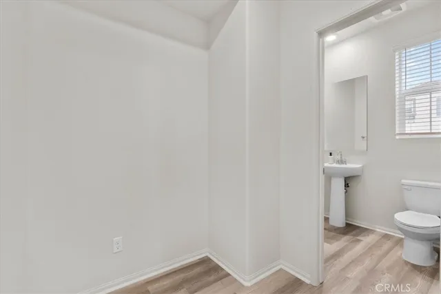 a bathroom with a sink a mirror and a toilet