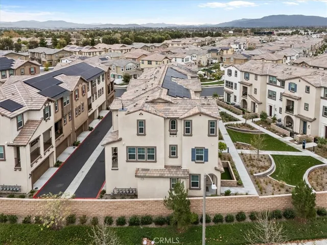 an aerial view of residential houses with outdoor space