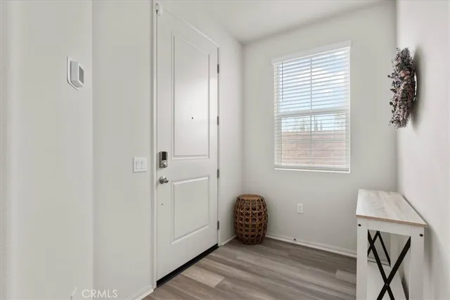 a view of room with window and hardwood floor