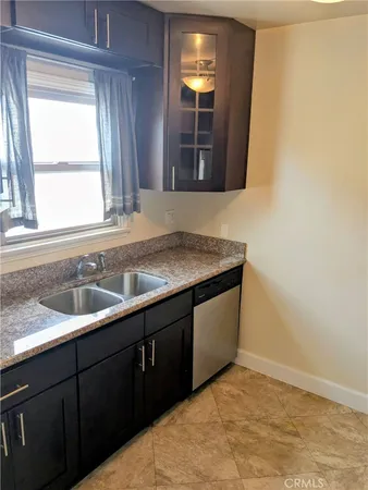 a kitchen with a sink and a window