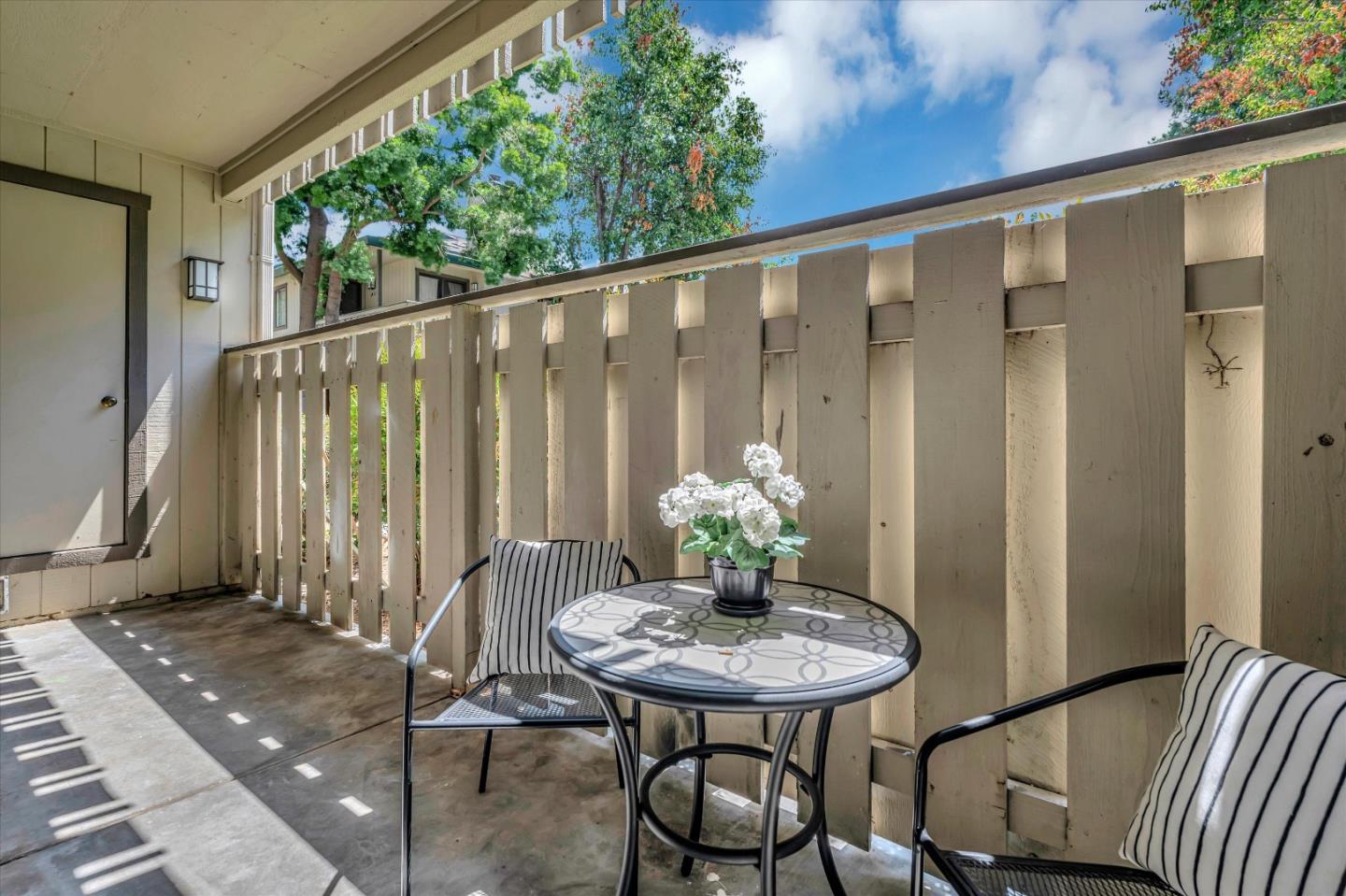 1415 Alma Loop San Jose, CA 95125 - Photo 18 of 25 a view of a balcony furniture and floor to ceiling window