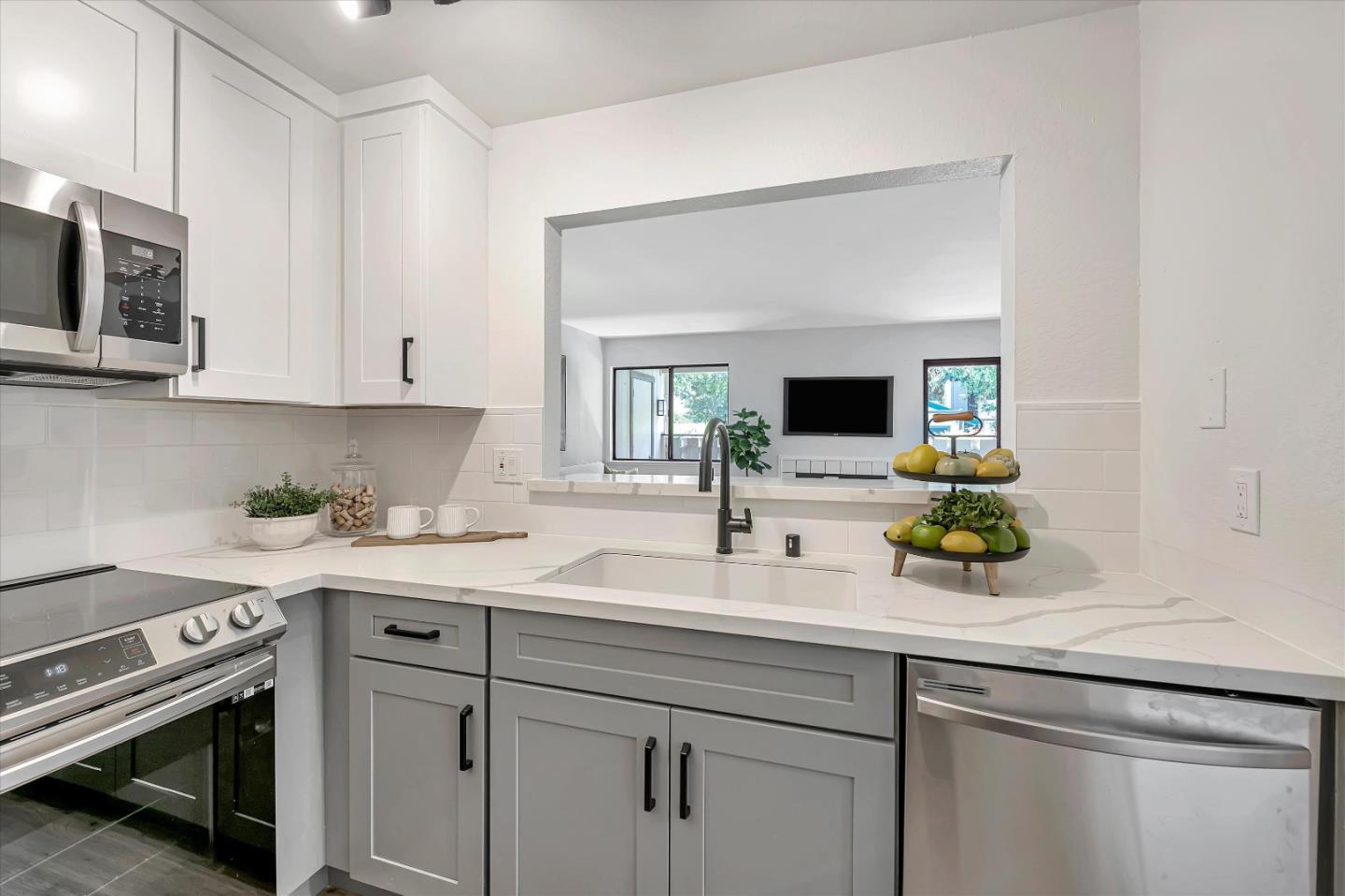 1415 Alma Loop San Jose, CA 95125 - Photo 7 of 25 a kitchen with stainless steel appliances white cabinets a sink and a stove