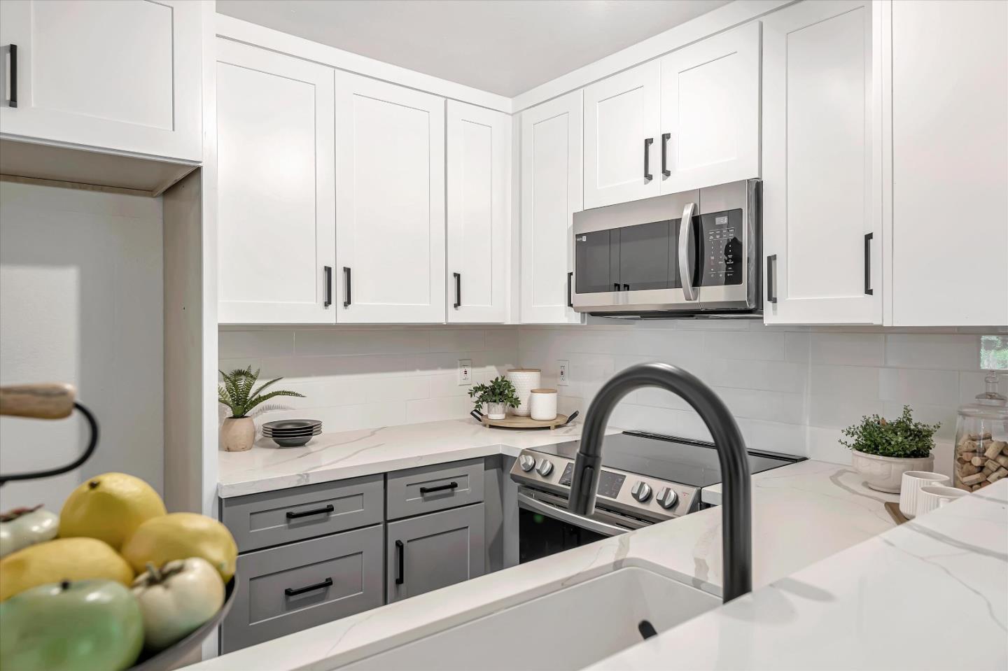 1415 Alma Loop San Jose, CA 95125 - Photo 8 of 25 a kitchen with stainless steel appliances a white cabinet a stove a microwave and cabinets