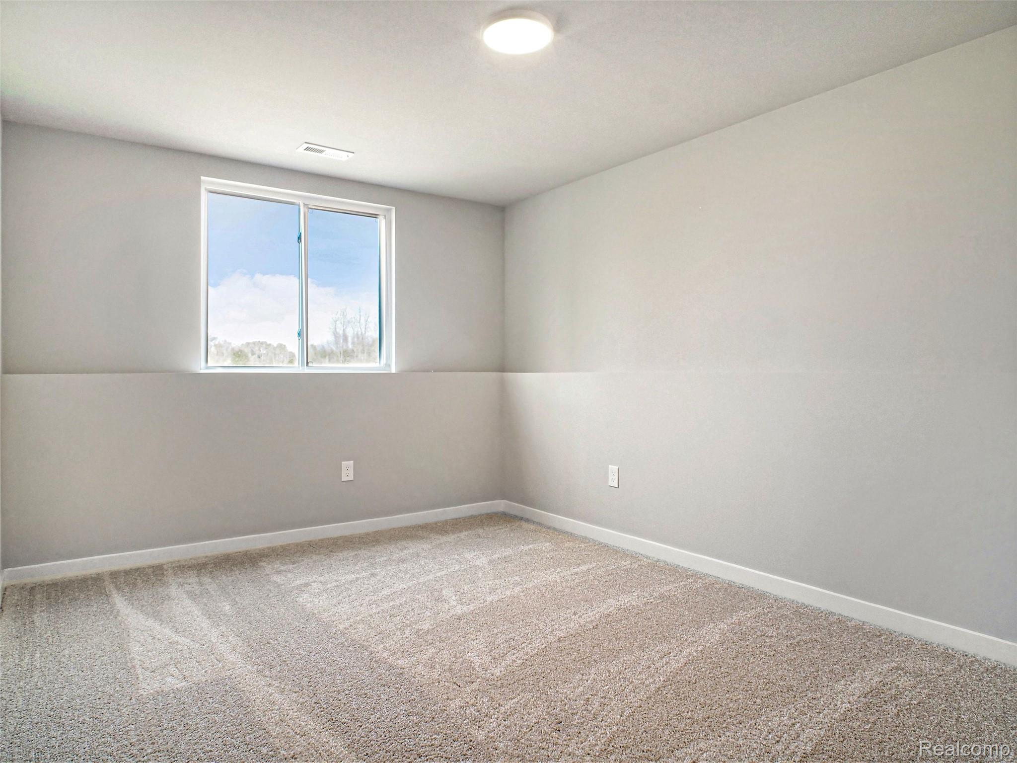 3166 Quail Ridge Court Clio, MI 48420 - Photo 12 of 23 Lower level bedroom 2