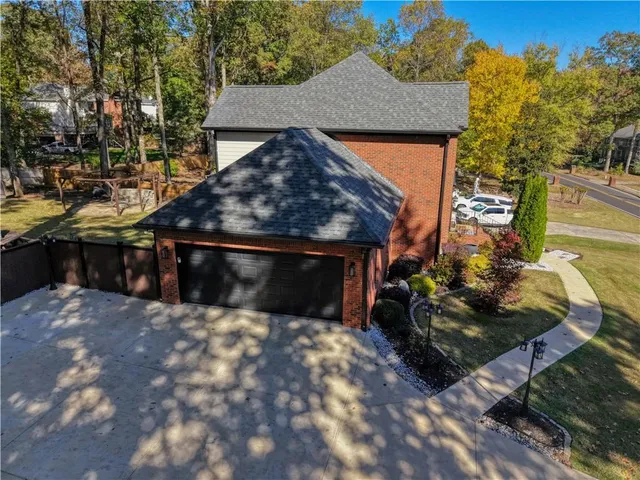 an aerial view of a house with swimming pool
