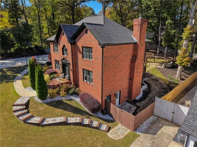 a aerial view of a house with garden space and sitting space