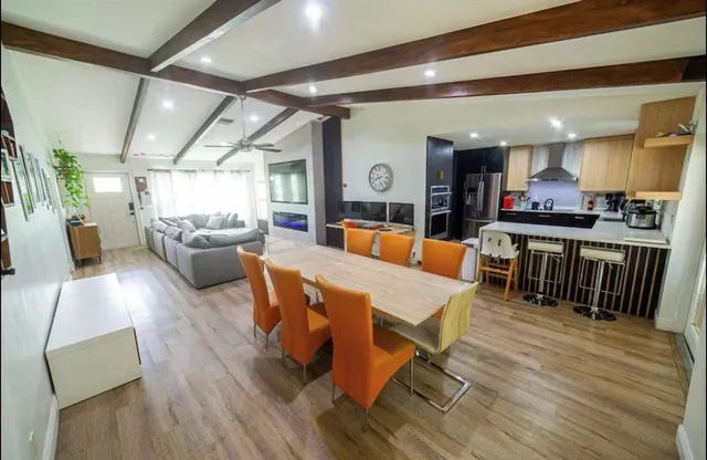 a view of a dining room with furniture window and wooden floor