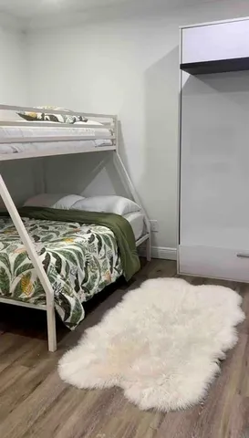 a bedroom with a bed and a table