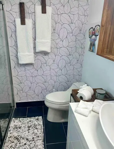 a bathroom with a toilet and a sink