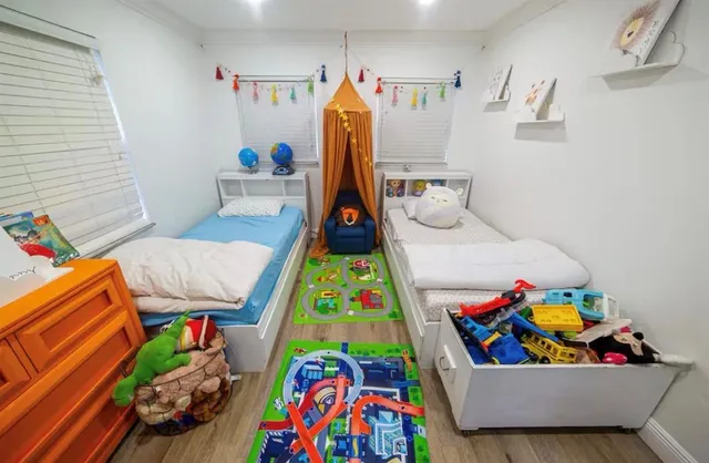 a bedroom with toys and a couch