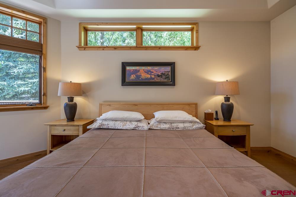 970 Red Rock Road Durango, CO 81301 - Photo 12 of 35 a bedroom with a large bed and a window