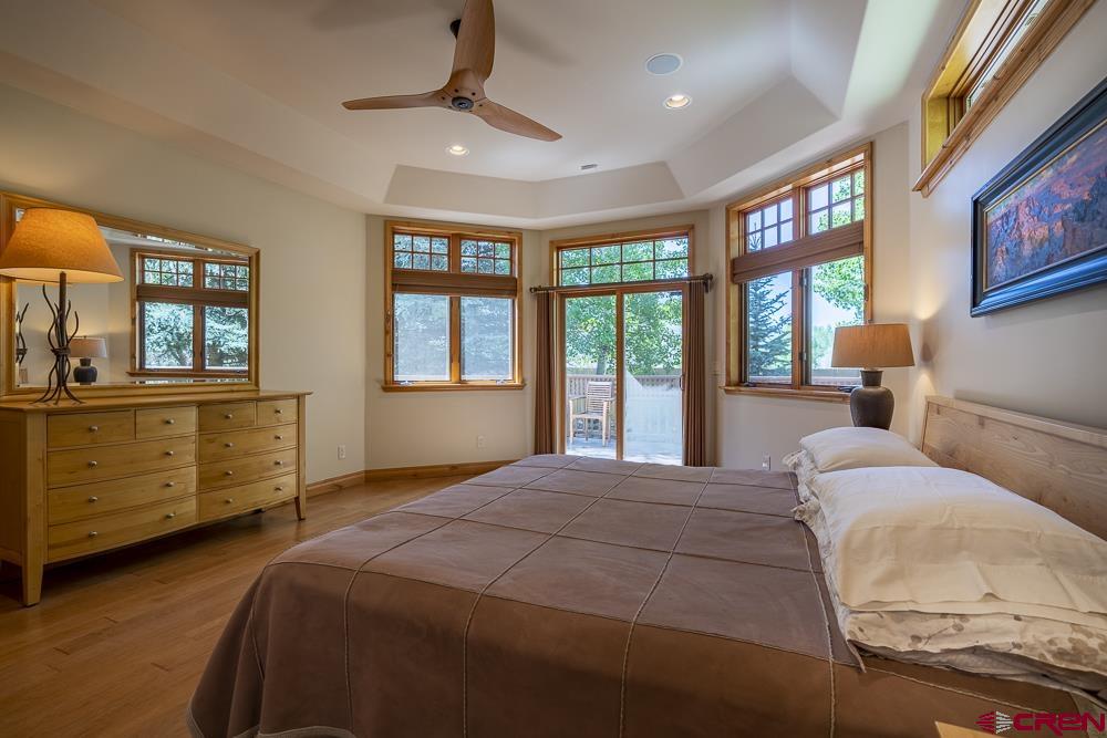 970 Red Rock Road Durango, CO 81301 - Photo 13 of 35 a bed room with a bed and a dresser
