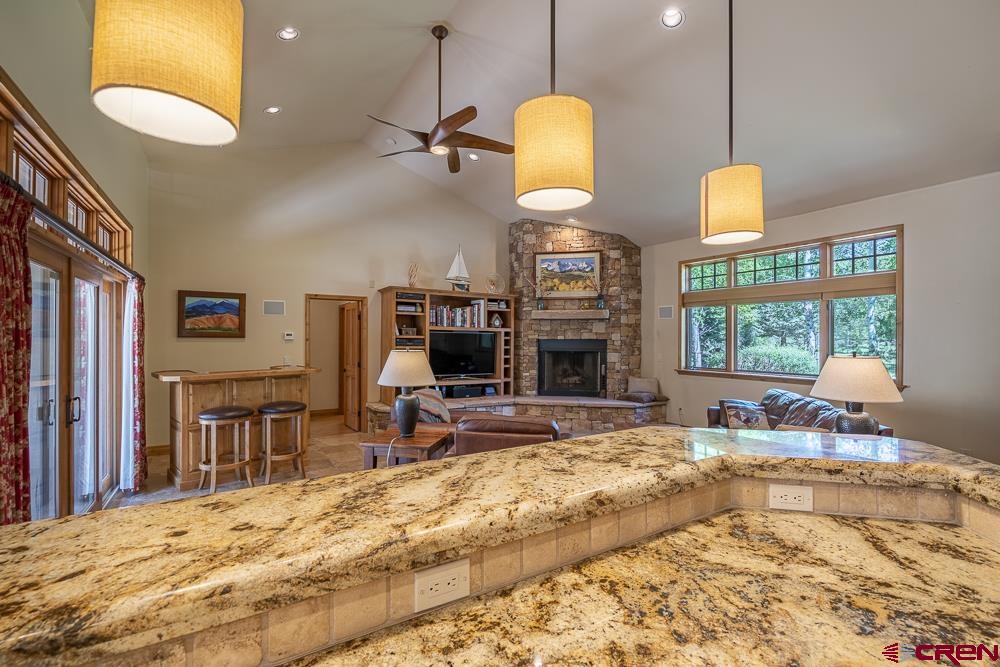970 Red Rock Road Durango, CO 81301 - Photo 16 of 35 a living room filled with furniture and a chandelier