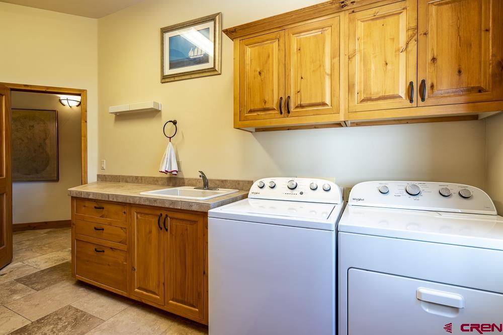 970 Red Rock Road Durango, CO 81301 - Photo 21 of 35 a utility room with dryer and washer