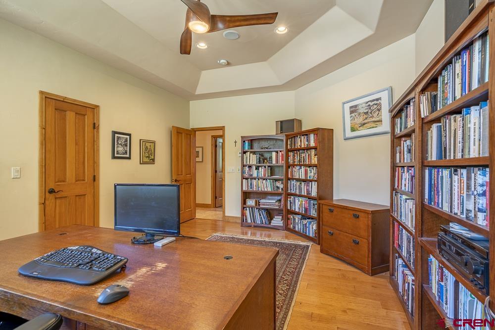 970 Red Rock Road Durango, CO 81301 - Photo 25 of 35 a bedroom with furniture and book shelf