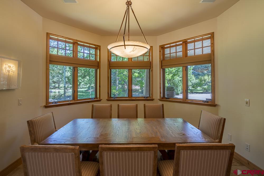 970 Red Rock Road Durango, CO 81301 - Photo 3 of 35 a view of a dining room with furniture window and outside view