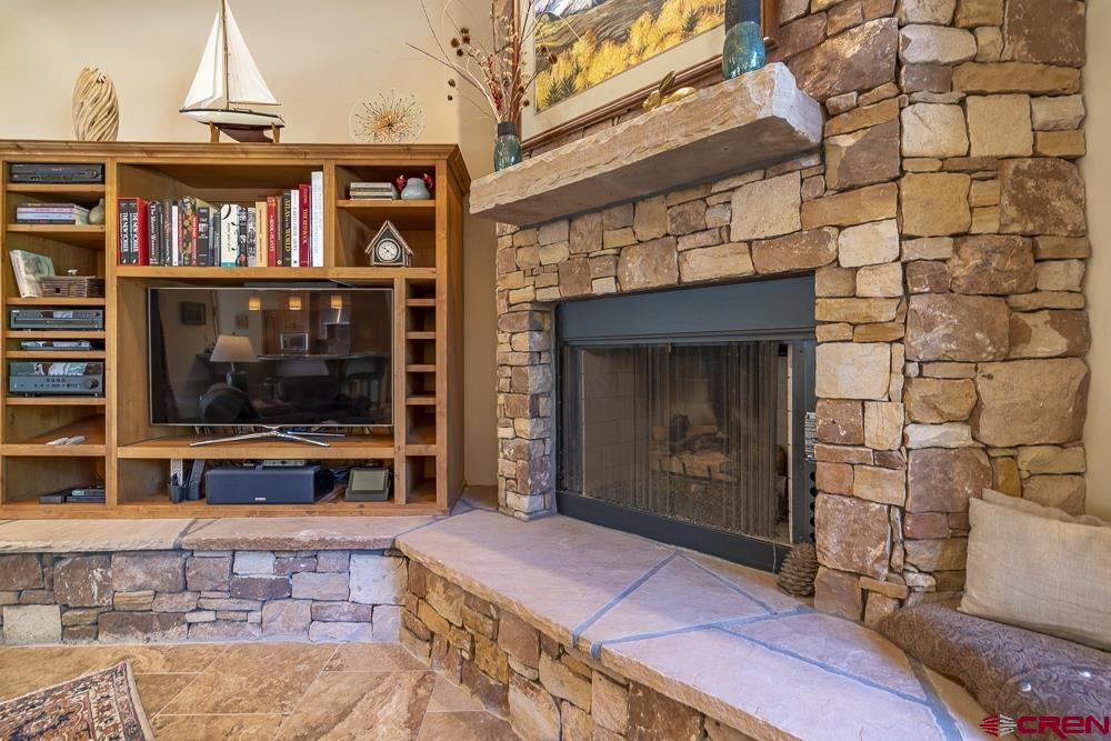 970 Red Rock Road Durango, CO 81301 - Photo 5 of 35 a view of a livingroom with furniture and a fireplace