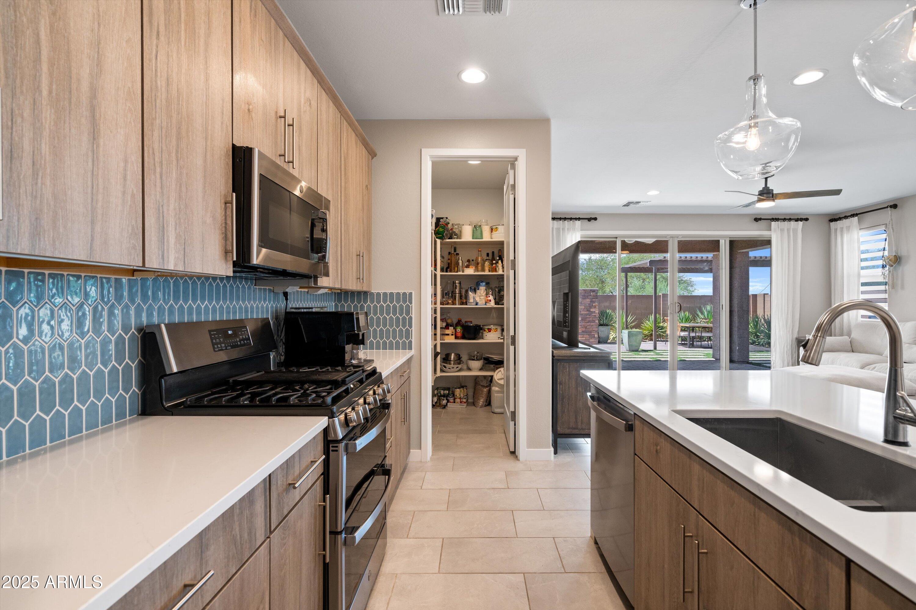 614 East Piedmont Road Phoenix, AZ 85042 - Photo 22 of 63 Kitchen to Pantry