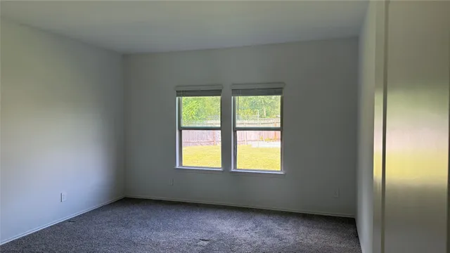 a view of an empty room and natural light