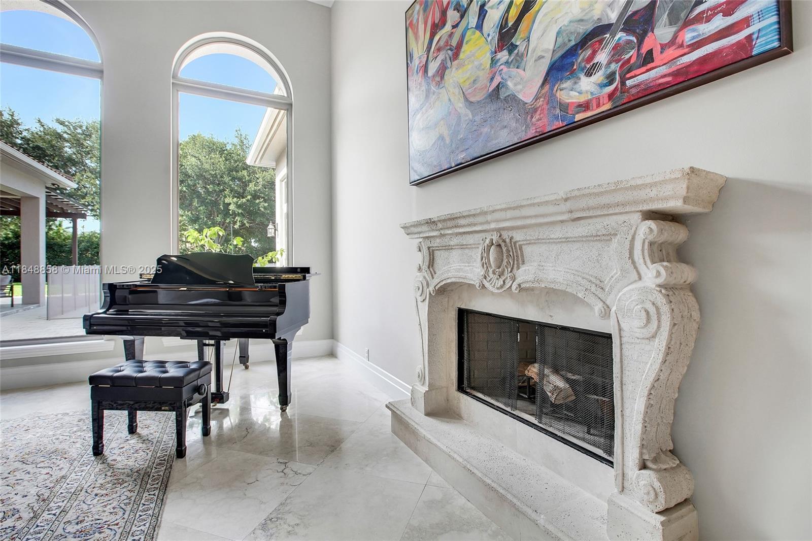 741 Ranch Road Weston, FL 33326 - Photo 13 of 35 a living room with furniture and a fireplace