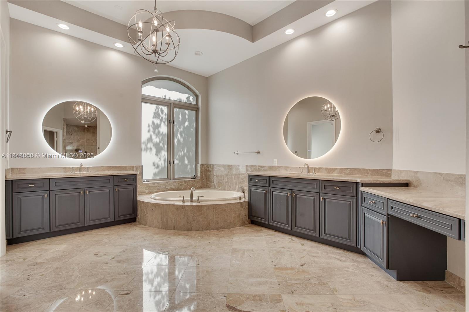 741 Ranch Road Weston, FL 33326 - Photo 17 of 35 a spacious bathroom with a granite countertop double vanity sink a mirror and a bathtub
