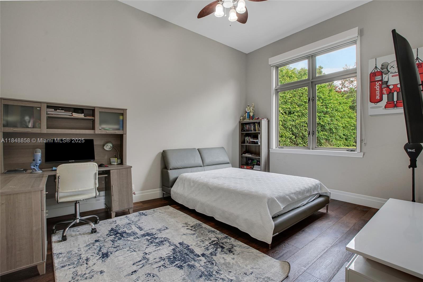 741 Ranch Road Weston, FL 33326 - Photo 19 of 35 a living room with a bed furniture and a window