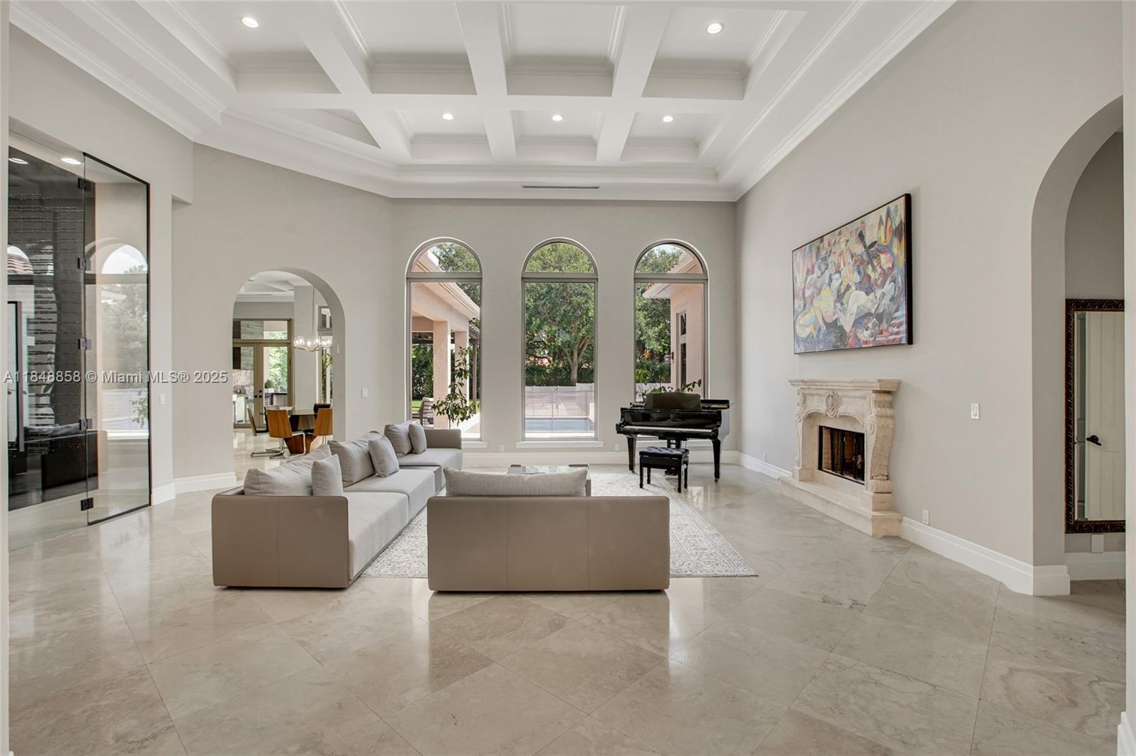 741 Ranch Road Weston, FL 33326 - Photo 2 of 35 a living room with furniture and a fireplace