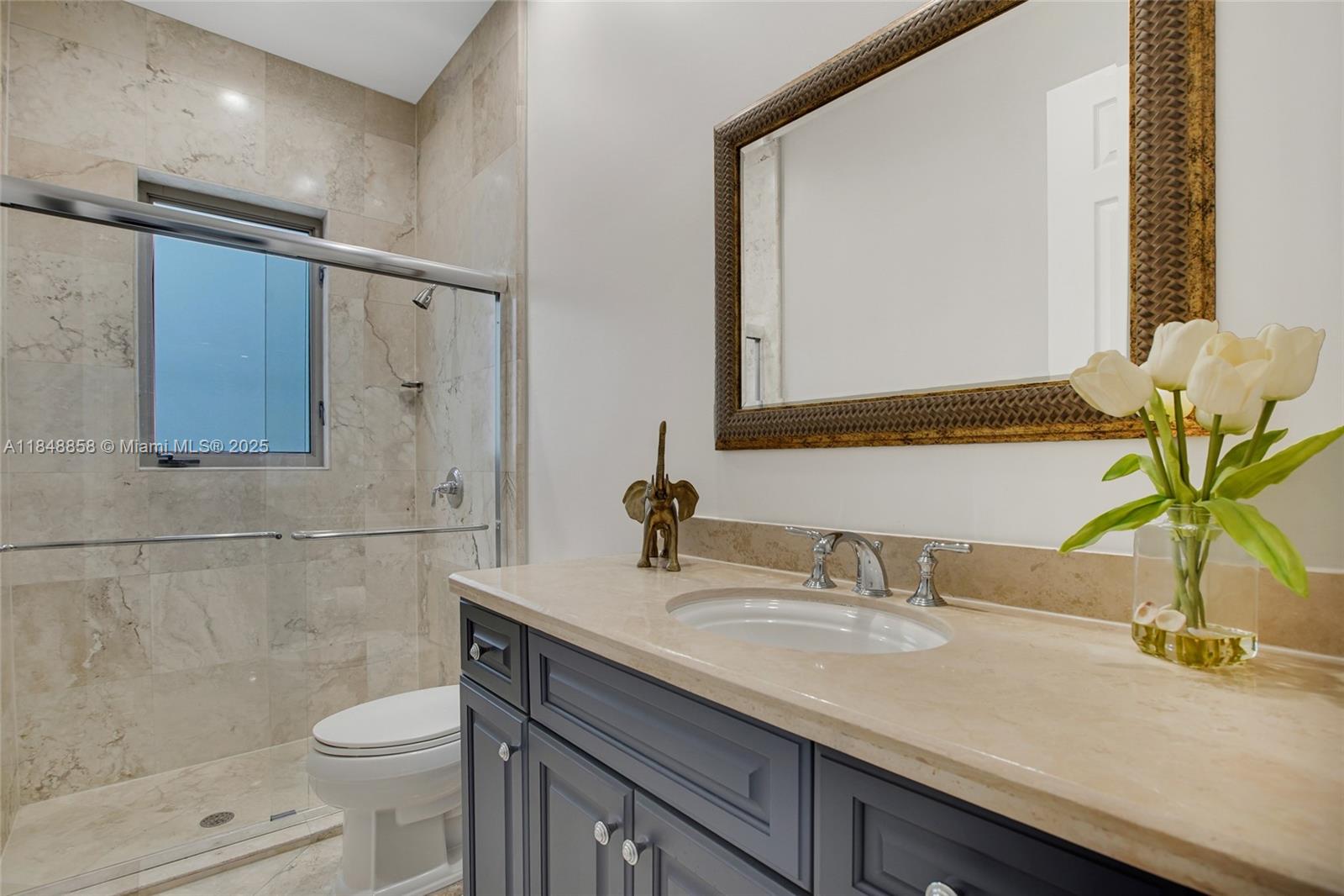 741 Ranch Road Weston, FL 33326 - Photo 22 of 35 a bathroom with a granite countertop sink a toilet and a mirror