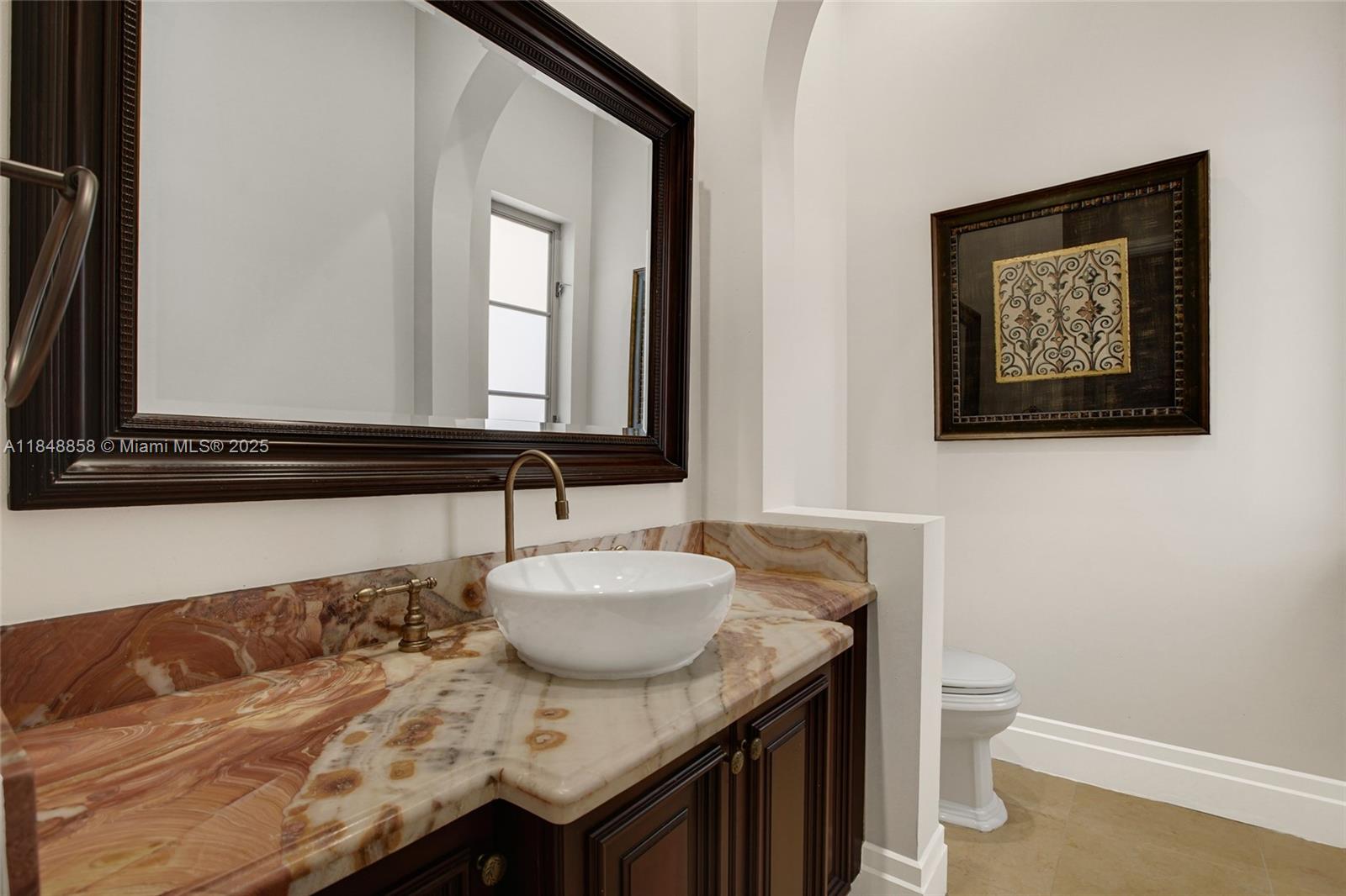 741 Ranch Road Weston, FL 33326 - Photo 26 of 35 a bathroom with a granite countertop sink and a mirror
