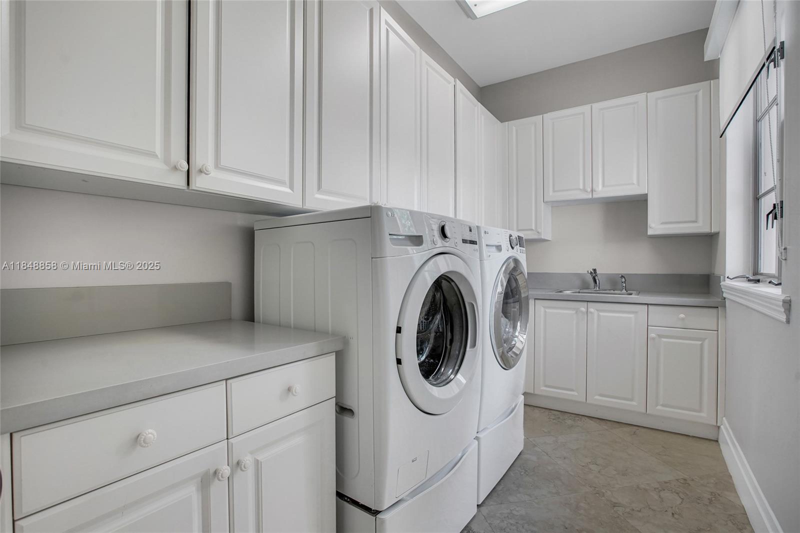 741 Ranch Road Weston, FL 33326 - Photo 27 of 35 a utility room with sink dryer and washer