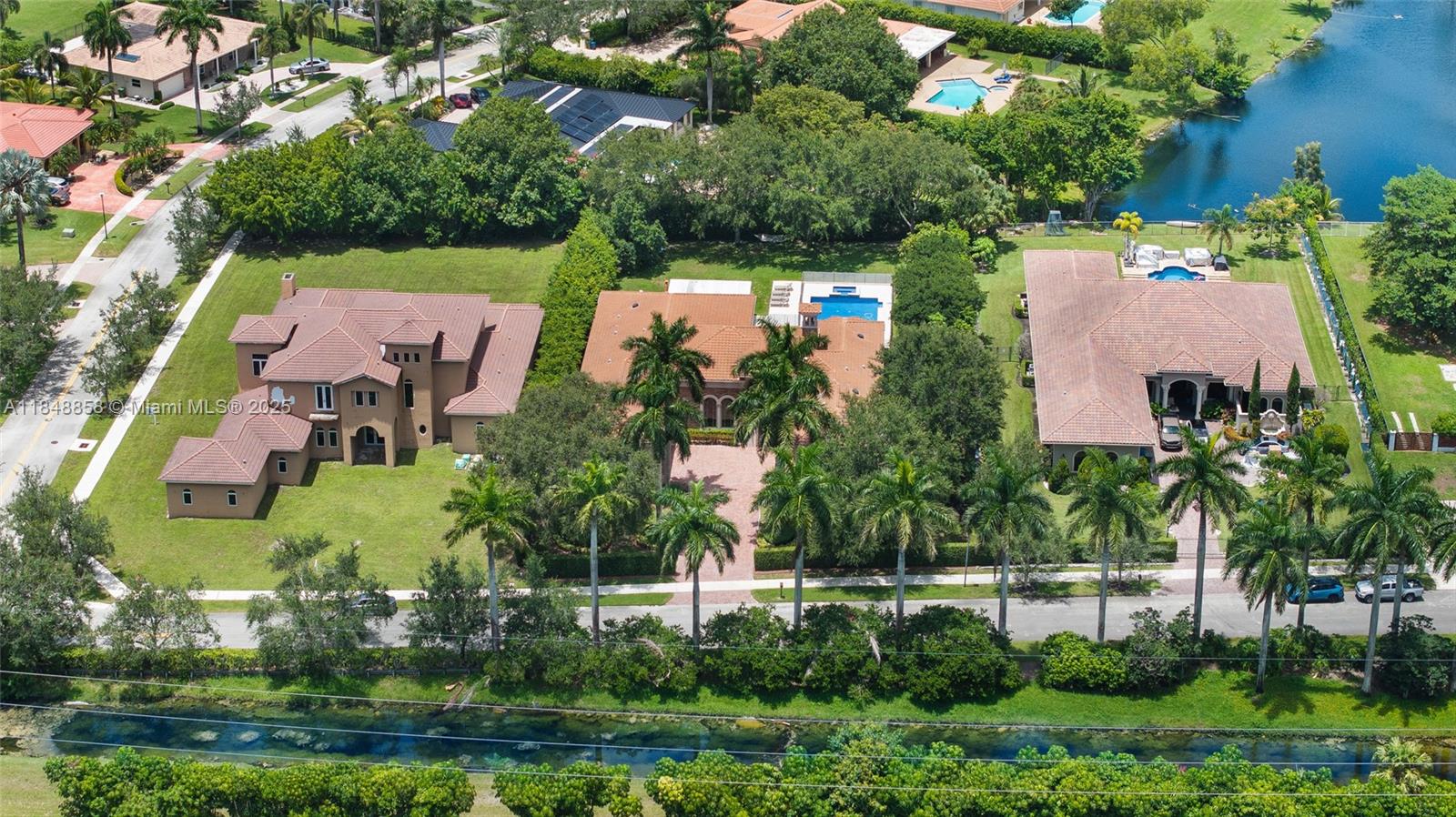 741 Ranch Road Weston, FL 33326 - Photo 34 of 35 an aerial view of a house with a yard and lake view