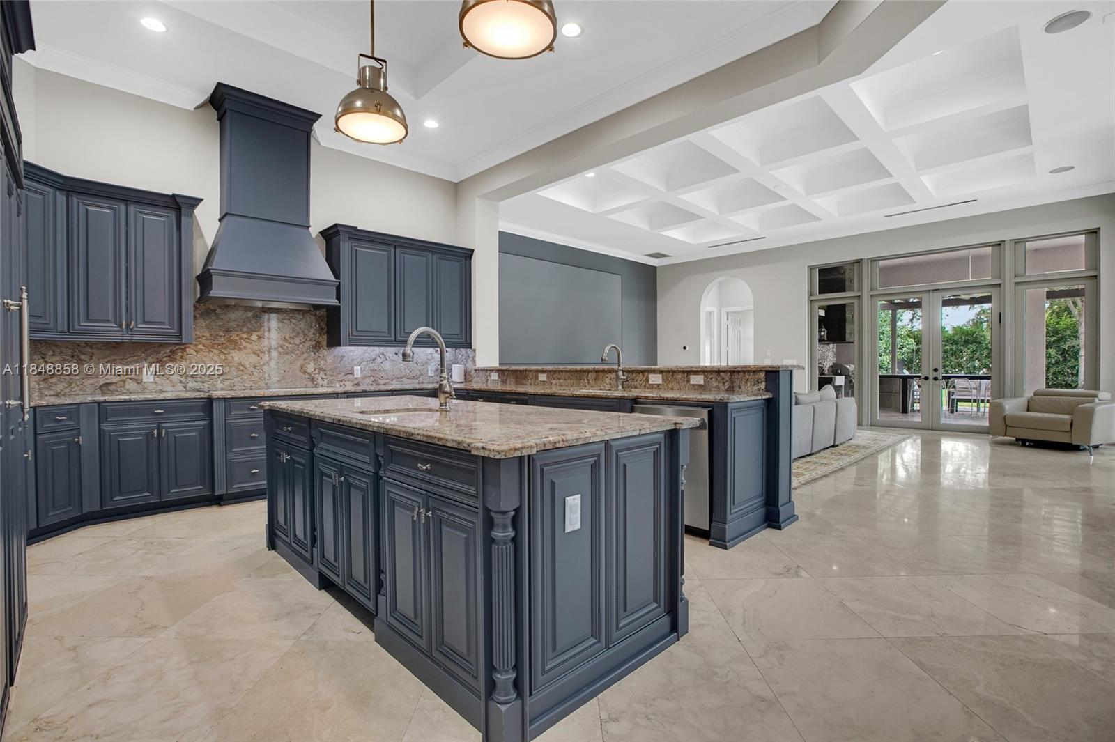 741 Ranch Road Weston, FL 33326 - Photo 5 of 35 a kitchen with stainless steel appliances granite countertop a stove a sink dishwasher and a microwave oven with cabinets