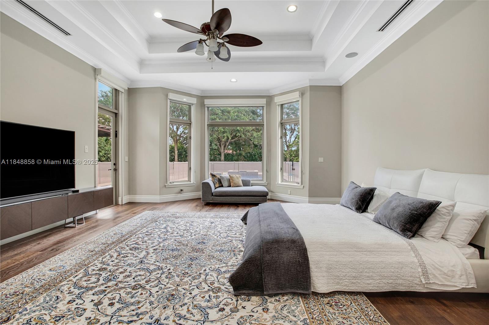 741 Ranch Road Weston, FL 33326 - Photo 7 of 35 a spacious bedroom with a bed and flat screen tv