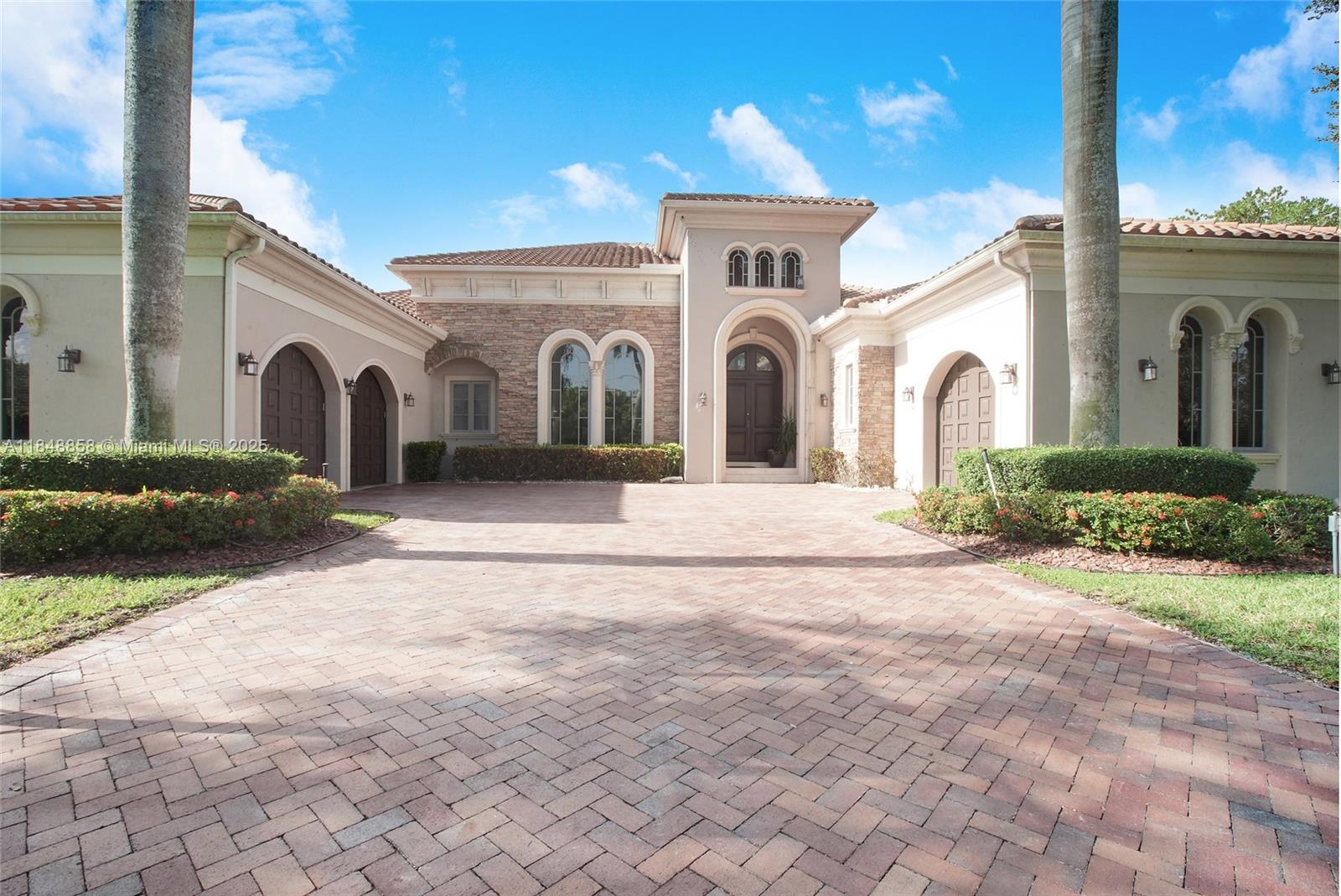 741 Ranch Road Weston, FL 33326 - Photo 9 of 35 a view of a house with a yard