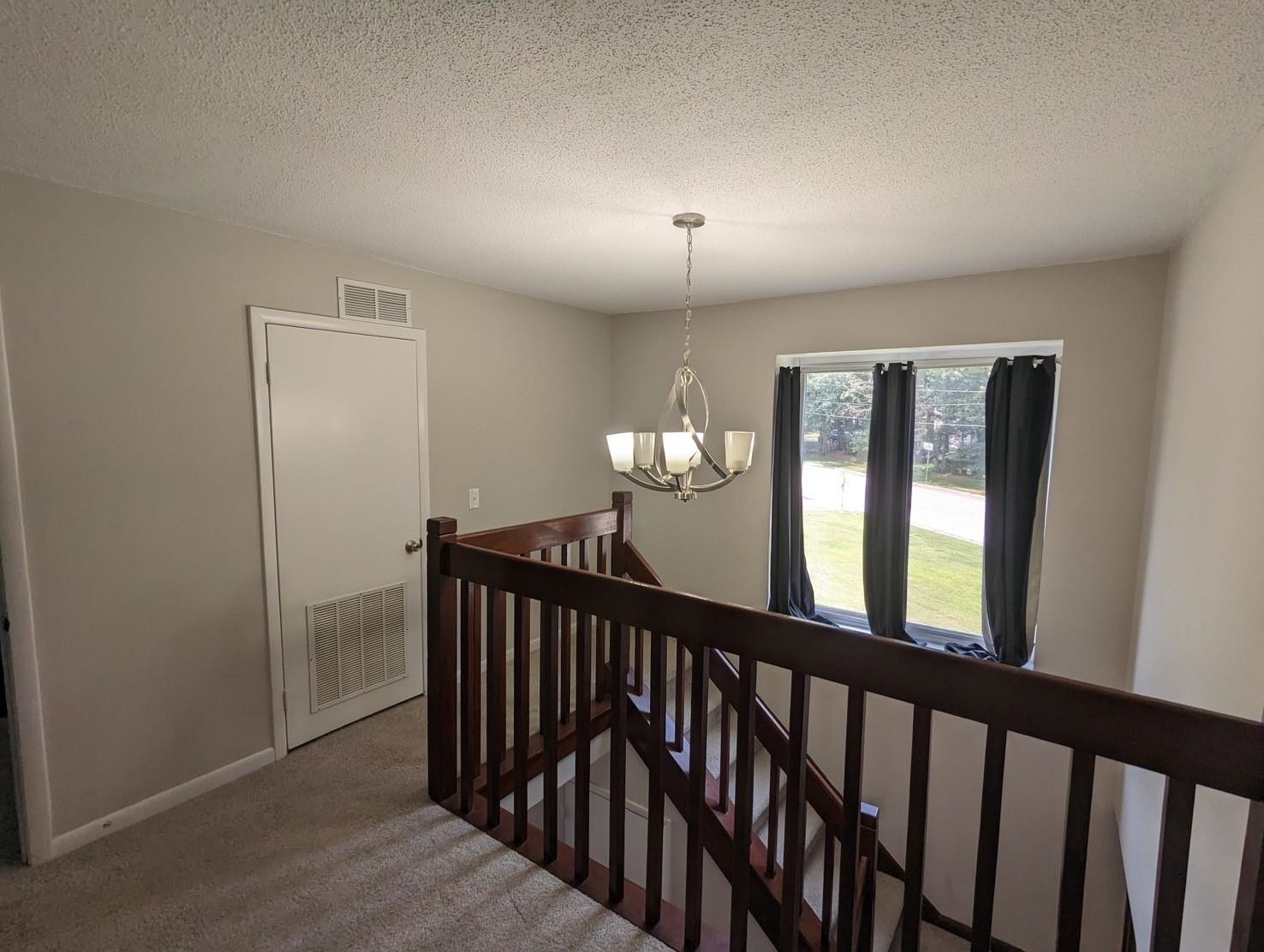1304 Seaton Road, Unit T1 Durham, NC 27713 - Photo 8 of 13 a view of a hallway with windows