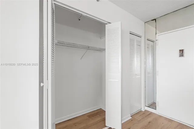 a bathroom with a shower a toilet and a sink