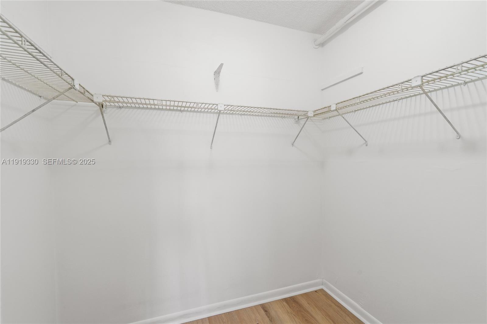 4101 Pine Tree Drive, Unit 1112 Miami Beach, FL 33140 - Photo 25 of 62 a view of a room with racks on the wall