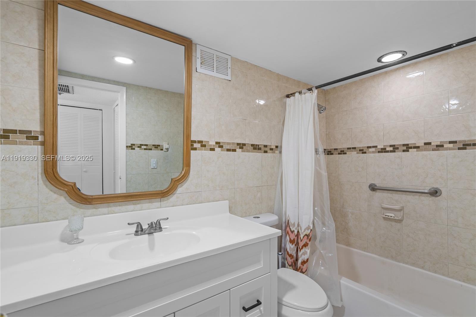 4101 Pine Tree Drive, Unit 1112 Miami Beach, FL 33140 - Photo 32 of 62 a bathroom with a sink toilet and shower