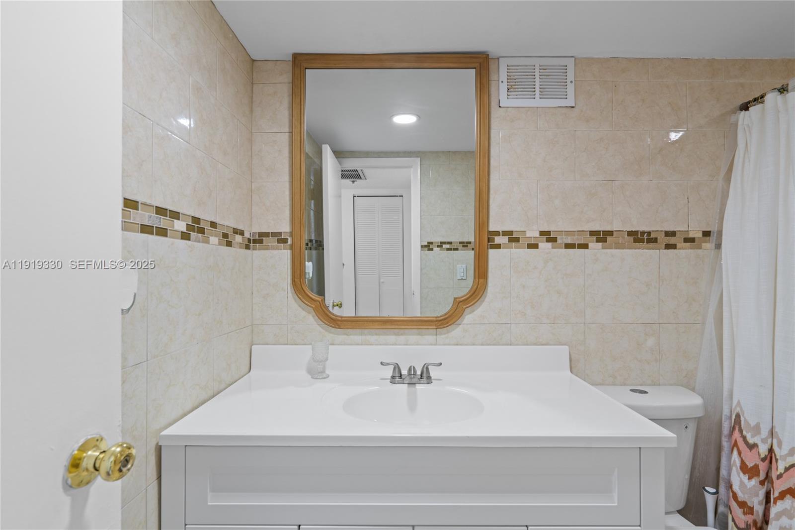4101 Pine Tree Drive, Unit 1112 Miami Beach, FL 33140 - Photo 33 of 62 a bathroom with a sink a toilet and shower