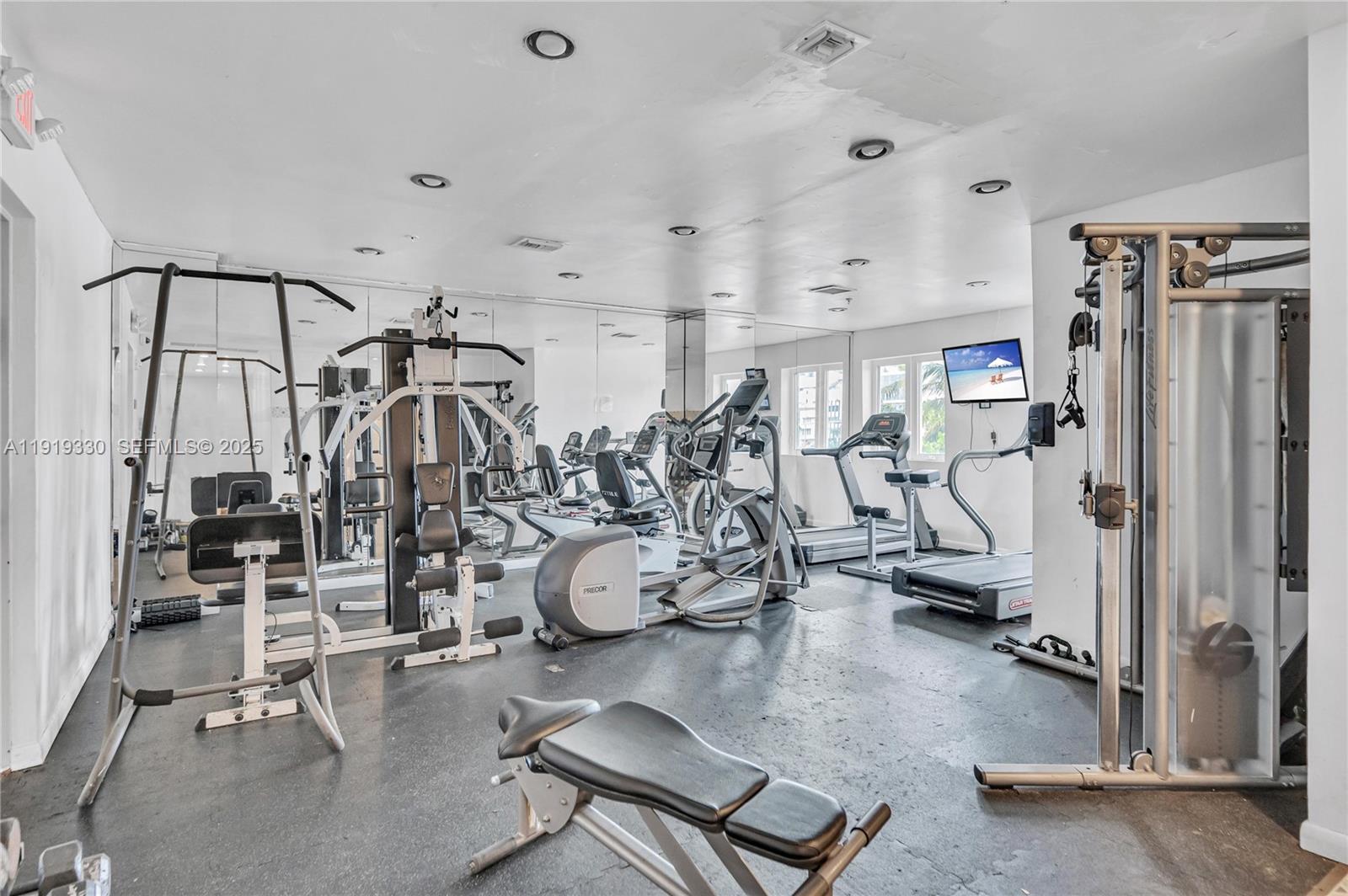 4101 Pine Tree Drive, Unit 1112 Miami Beach, FL 33140 - Photo 45 of 62 a view of a room with gym equipment