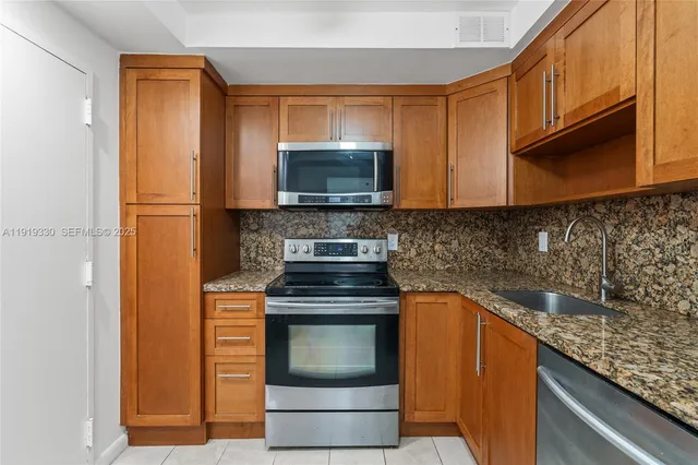 a view of a room with wooden floor and windows