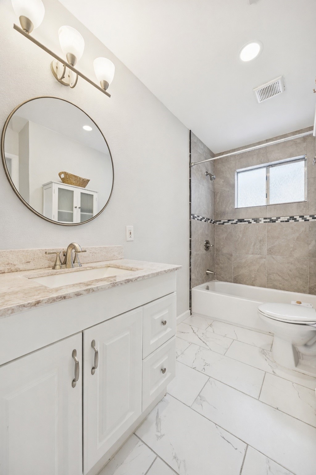 2614 Cleburne Street Houston, TX 77004 - Photo 9 of 17 a bathroom with a granite countertop sink a mirror and shower